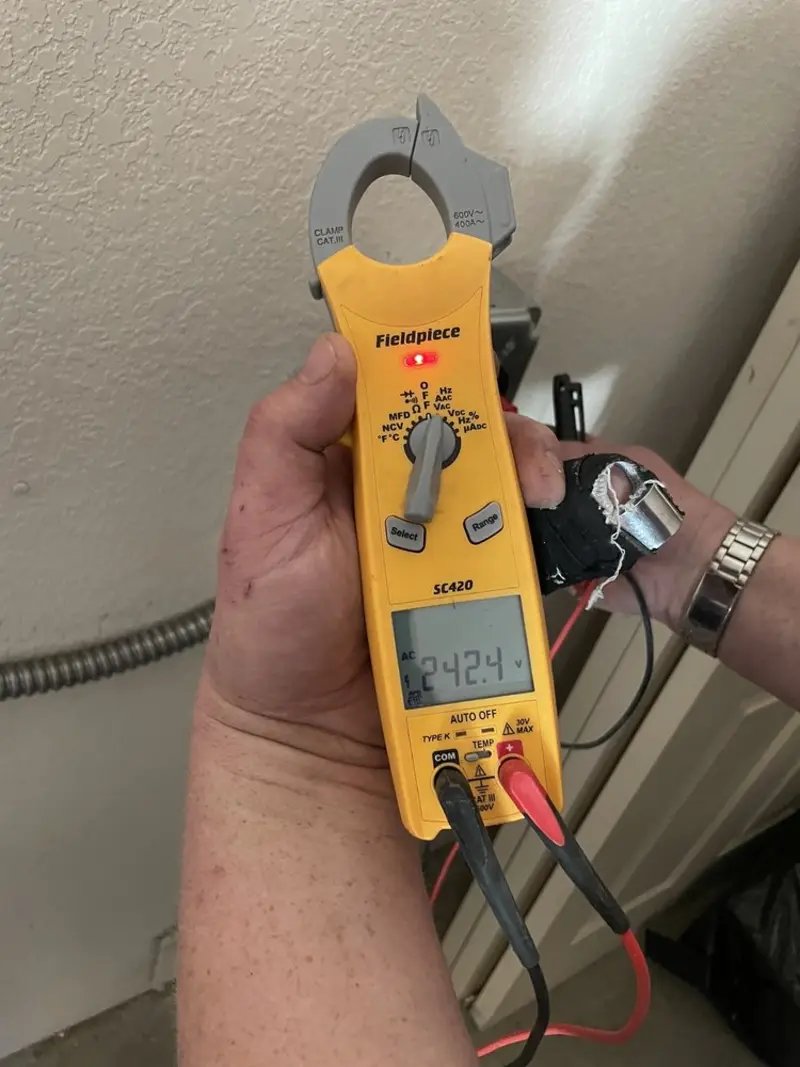 Voltage testing with clamp meter during Electrical Installation Services in Coleman